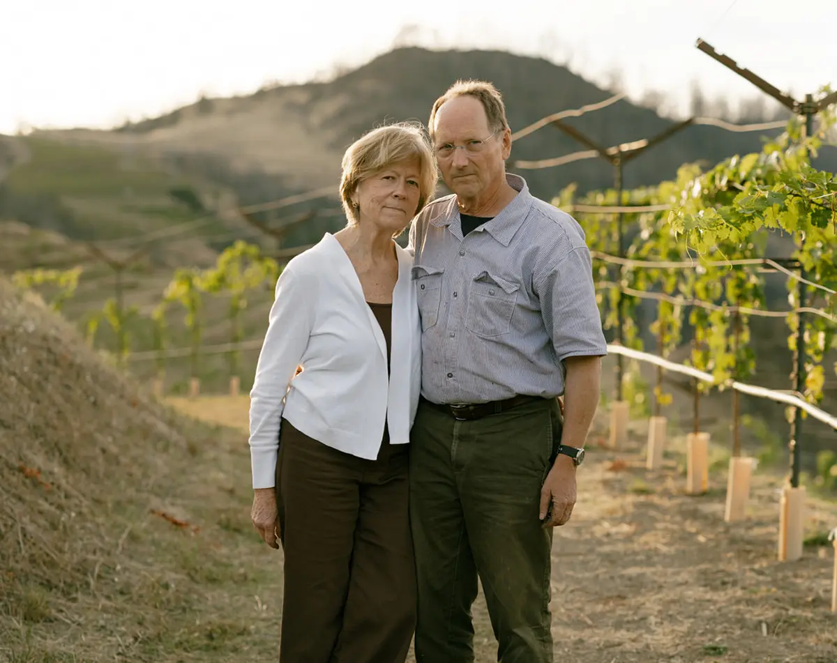 Katie Lazar and Chris Howell in the Cain Vineyard, regrowing after the Glass Fire. Photo by Meg Smith, courtesy of Club Oenologique.