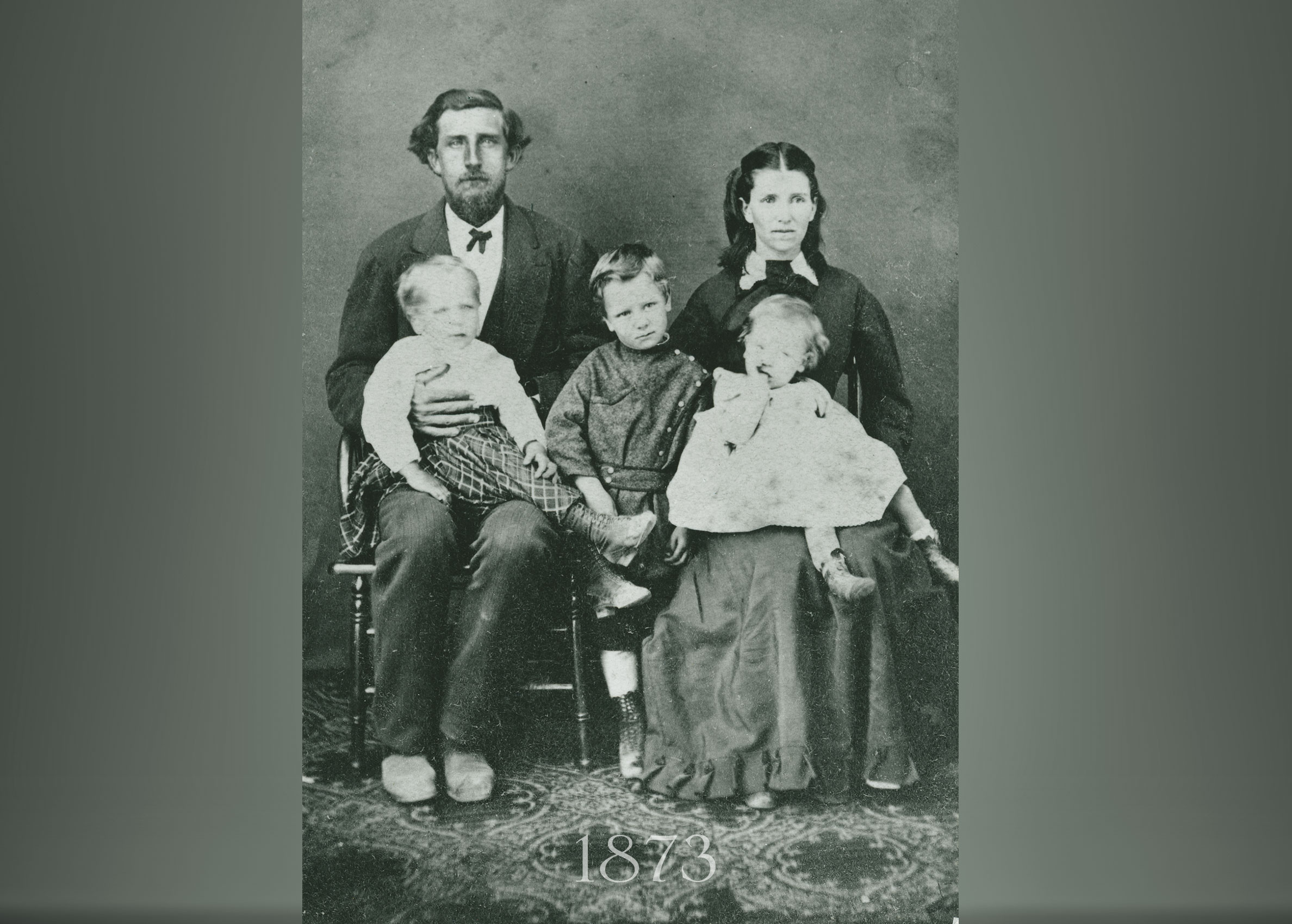 Early settlers of what is now Cain Vineyard, Henry Mixer McCormick and Molly Hudson McCormick with three of their five children, taken around 1873. John is sitting on Henry's lap.