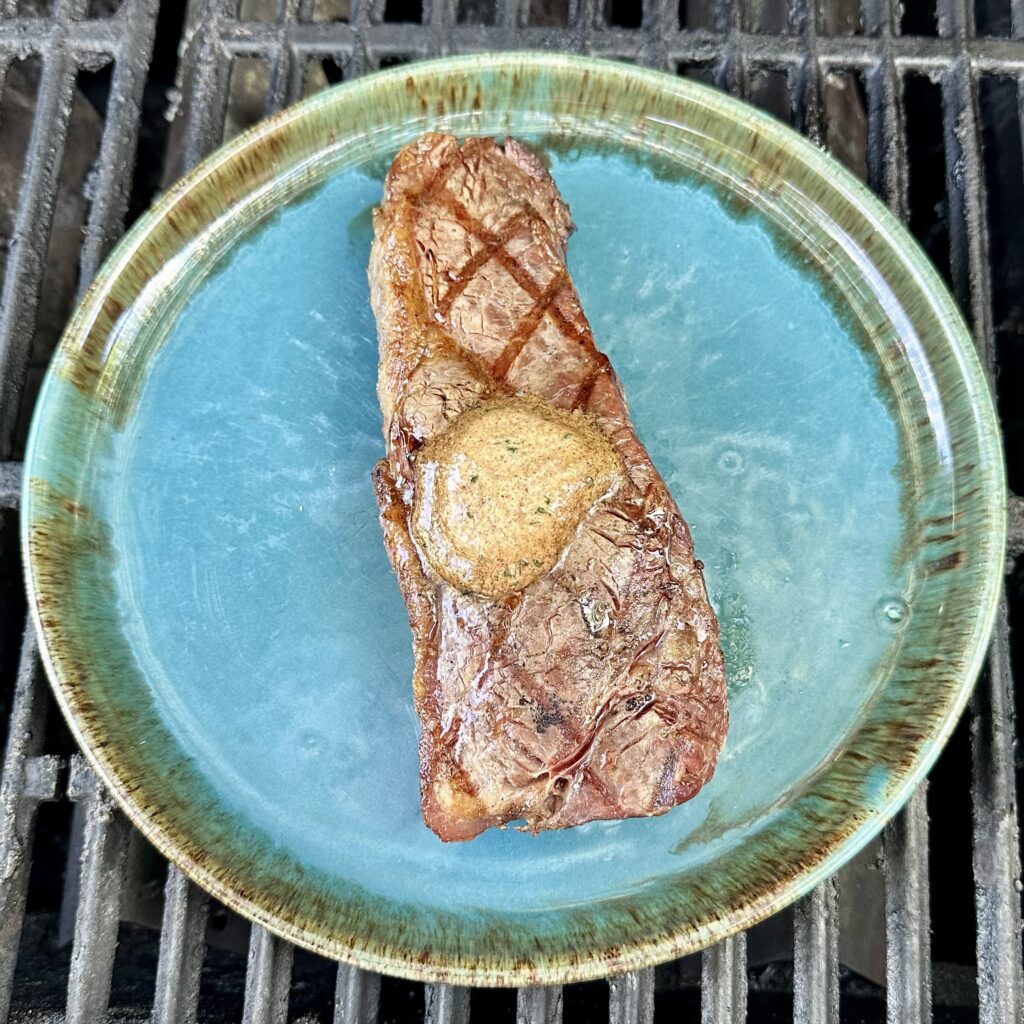 Recipes to Pair with Cain Cuvée: Porcini Parmesan Butter (on New York strip steak in photo)